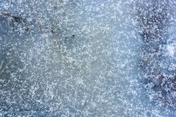 Frozen water covered with snow texture background