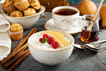 Rice pudding with raspberries and pears for breakfast
