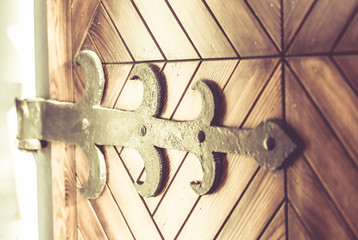 vintage wood gate with  metal door hinge