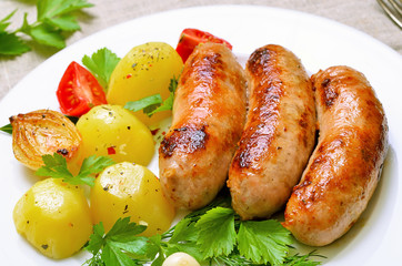 Grilled sausages and boiled potatoes