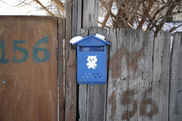 Mail box on the wooden fence