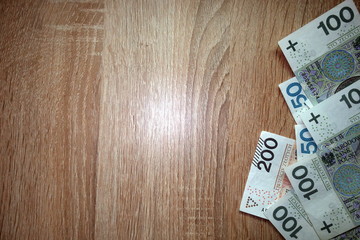 Polish money on table background 