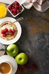 Steel cut oatmeal porridge with raspberry and coconut