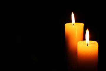 Fototapeta na wymiar two candles lit right