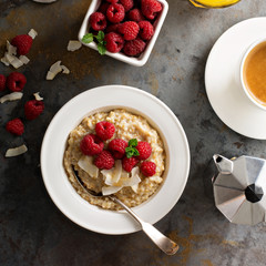 Steel cut oatmeal porridge with raspberry and coconut