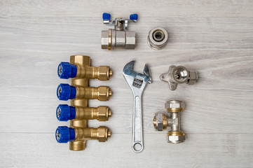 Set with a wrench and metal fittings on a white background