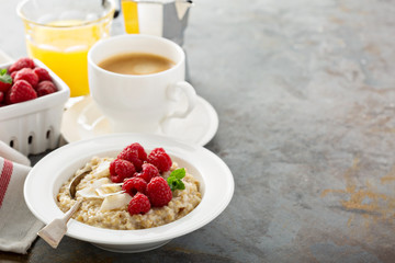 Steel cut oatmeal porridge with raspberry and coconut