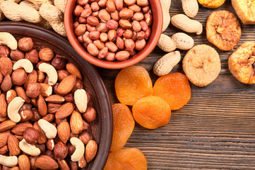 Nuts in plate and dried fruits