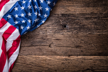 USA flag. American flag. American flag freely lying on wooden board. Close-up Studio shot. Toned...