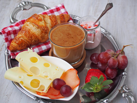 Health breakfast.Cup of coffee espresso with croissant and cheese