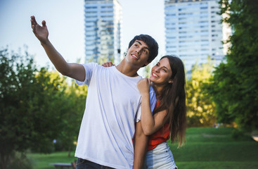 portrait of happy Hispanic couple in the park