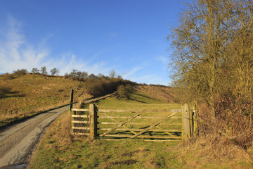 rustic wooden gates in a winter landscape