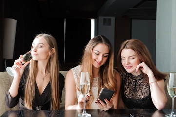 always connected, internet addiction, young girls in cafe lookin