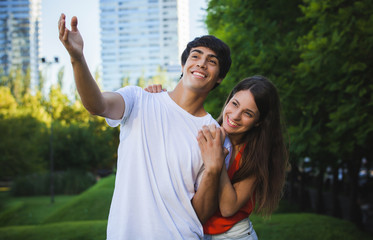 Fototapeta premium portrait of happy Hispanic couple in the park