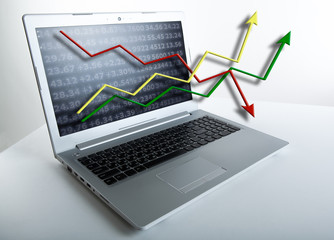 working at a laptop analytics forecasting calculations