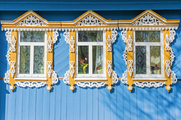 facade Russian house with carved architraves - obrazy, fototapety, plakaty