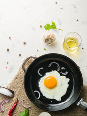 Morning in the kitchen. Cooking breakfast. Fried egg.