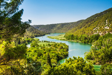 Fototapeta premium Two ships sail on the river. Around the forest and mountains. Kr