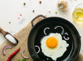 Morning in the kitchen. Cooking breakfast. Fried egg.