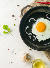 Morning in the kitchen. Cooking breakfast. Fried egg.