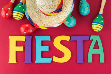 Mexican fiesta table decoration with  colorful painted letters, maracas