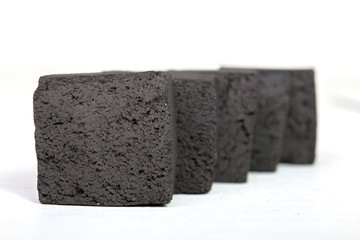 Group charcoal briquettes  on white background, coal for hookah
