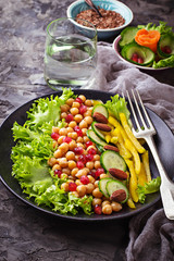 Salad with cucumber, pepper, pomegranate chick-pea