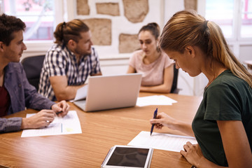 Young lady checking her memo notes