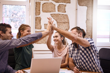 Young business team celebrating a breakthrough