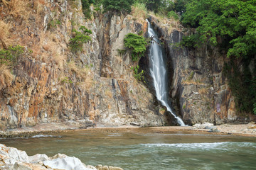 Bay, steep cliff and a waterfall at the Waterfall Bay Park in Hong Kong, China. © tuomaslehtinen