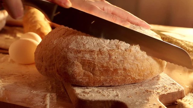 Cutting a bread in slow motion