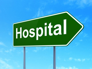 Health concept: Hospital on road sign background