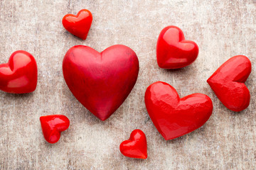 Red heart on the wooden background.