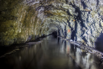 Flooded tunnel of an old abandoned coal mine 