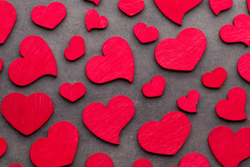 Red hearts on the wooden background.