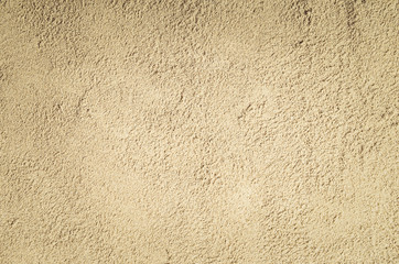 Top view of sandy beach. Background with copy space and visible sand texture.