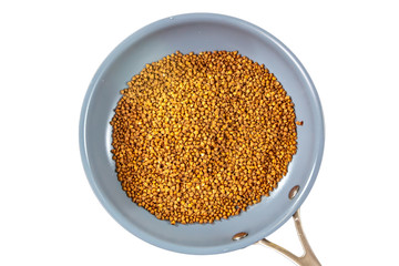 Dry buckwheat groats roasted dry the pan before it is boiled in water.