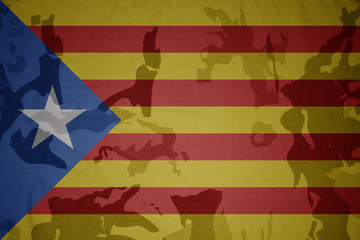 flag of catalonia on the khaki texture . military concept