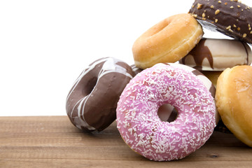 donut stacked on wood with white background