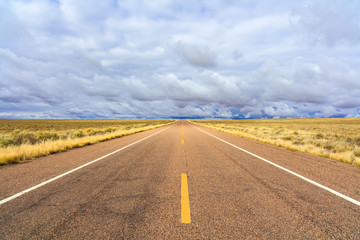 Rural two lane highway in the Arizona desert.