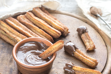 Churros - famous Spanish dessert with chocolate sauce