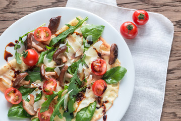 Crepes with cherry tomatoes, cheese, mushrooms and arugula