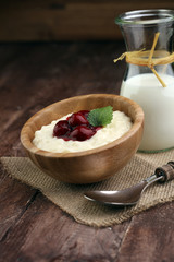 Milk rice pudding with hot cherries