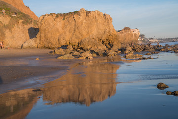 Fototapeta na wymiar Reflections in the surf at Sunset at El Matador State Beach near Malibu California
