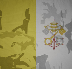 flag of vatican city on the khaki texture . military concept