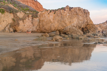 Fototapeta na wymiar Late Afternoon sunlight bathes the rocks at El Matador State Beach near Malibu California
