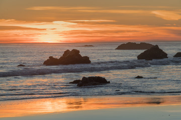 Fototapeta na wymiar Red sunset at El Matador State Beach near Malibu California