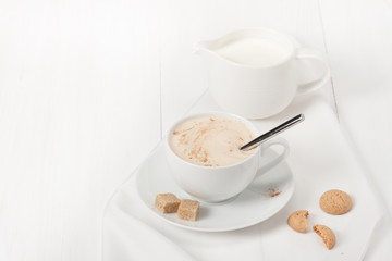 Amaretti Biscuits. Cup Of Cappuccino Coffee. Lump Demerara Sugar