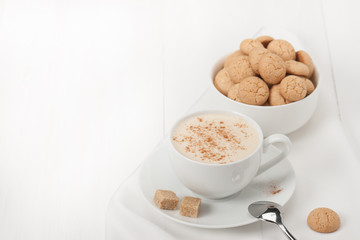 Amaretti Biscuits. Cup Of Cappuccino Coffee. Lump Demerara Sugar