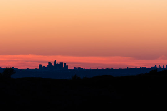 Sunset over downtown silhouette of Los Angeles.